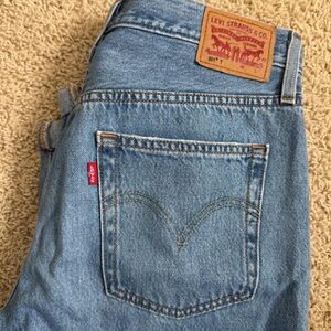 Levi’s 501 tapered jeans with distressing
